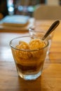 Cold Brew Iced Coffee Affogato, Vanilla Ice-Cream in a glass on wooden table background in Vietnamese coffee shop Royalty Free Stock Photo