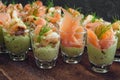 Cold buffet with appetizers in glasses, prawn shrimps and salmon Royalty Free Stock Photo