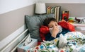 Cold child lying on the bed Royalty Free Stock Photo