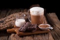 Cold Chocolate Milk drink and chocolate bar on wooden background Royalty Free Stock Photo