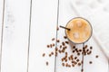 cold coffee glass with ice cubes on white table background top view mockup Royalty Free Stock Photo