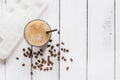 Cold coffee glass with ice cubes on white table background top view mockup Royalty Free Stock Photo