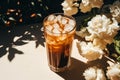 cold coffee near flowers background