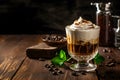 Cold coffee with vanilla ice cream in a glass on a black wooden background. Irish coffee delight Royalty Free Stock Photo