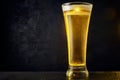 Cold craft light Beer in a glass with drops on a dark table. Pint of Beer on black color background Royalty Free Stock Photo