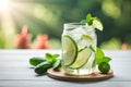 cold cucumber water, lemonade in a glass with slices of lime and lemon over wooden background, detox drink created with Royalty Free Stock Photo