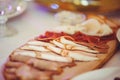 Cold cuts with ham, bacon, salami and bacon on a light background. Meat platter Royalty Free Stock Photo