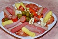 Cold cuts plate containing: cheese, sausage, ham, olives, salami and mortadella Royalty Free Stock Photo