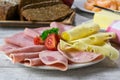 Cold cuts plate on wooden table Royalty Free Stock Photo