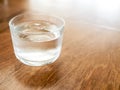 Cold drinking water in glass on wooden table Royalty Free Stock Photo