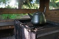 Cold and empty coffee pot in the fireplace Royalty Free Stock Photo