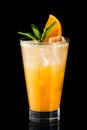 Cold fizz cocktail with orange isolated on black Royalty Free Stock Photo