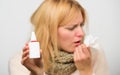 Cold and flu remedies. Runny nose and other symptoms of cold. Nasal drops bottle. Nasal spray runny nose remedy. Woman Royalty Free Stock Photo
