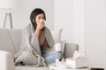 Cold and flu. Sick girl with runny nose drinking hot tea Royalty Free Stock Photo