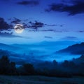Cold fog on blue night in mountains Royalty Free Stock Photo