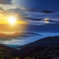 cold fog in the valley with sun and moon at twilight. day and night time change concept Royalty Free Stock Photo