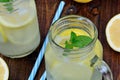 Cold fresh citrus lemonade in mason jars on table Royalty Free Stock Photo