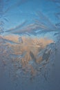 Cold frost patterns on glass Royalty Free Stock Photo