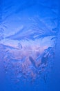 Cold frost patterns on glass Royalty Free Stock Photo