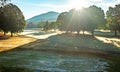 cold frosty early morning on golf course in the mountains Royalty Free Stock Photo