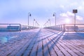 A cold frosty morning, a wooden pier. Winter colors.