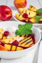 Cold fruit soup with raspberry, grilled nectarines, ice cream, vertical Royalty Free Stock Photo