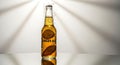 Cold glass bottle of ginger ale with lemon slices and bubbles, studio light effects Royalty Free Stock Photo