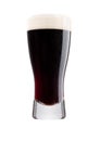 Cold glass of dark beer with foam and dew Royalty Free Stock Photo