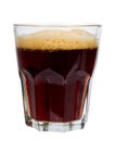 Cold glass of dark beer or kvass with foam isolated on white background. Royalty Free Stock Photo