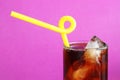 Glass of Cola with a yellow straw Royalty Free Stock Photo