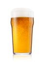 Cold glass of lager ale beer with foam and dew Royalty Free Stock Photo
