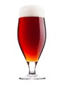 Cold glass of red bitter beer with foam and dew Royalty Free Stock Photo