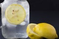 Cold glass of water with ice cubes and a slice of lemon. Royalty Free Stock Photo