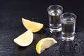 Cold glasses of vodka with slices of lemon