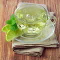 Cold green tea with ice cubes, lime sliced Royalty Free Stock Photo