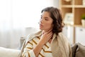 Unhappy sick woman with sore throat at home Royalty Free Stock Photo