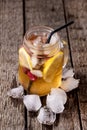 Cold Ice Tea with Slice of Lemon and Raspberry in Mason Jar on the Wooden Rustic Background Vertical Tasty Cold Tea Royalty Free Stock Photo