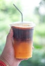 Cold iced black brew coffee mixed orange juice, fresh summer drink in the morning Royalty Free Stock Photo