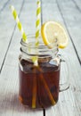 Cold iced tea with straws and lemon slices. Royalty Free Stock Photo