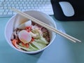 Cold Japanese Noodles in a Cup on the Office Desk