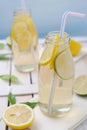 Cold lemon drink with slices of lime and lemon Royalty Free Stock Photo