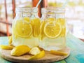 Cold Lemonade ice, in jugs, straw, urban view Royalty Free Stock Photo