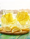 Cold Lemonade ice, in jugs, straw, urban view Royalty Free Stock Photo