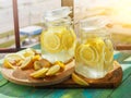 Cold Lemonade ice, in jugs, straw, urban view Royalty Free Stock Photo