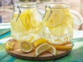 Cold Lemonade ice, in jugs, straw, urban view Royalty Free Stock Photo