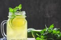Cold lemonade mojito in a glass jar with lime and mint Royalty Free Stock Photo
