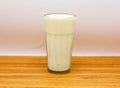 cold milk glass isolated on table top view of indian and pakistani spicy food
