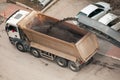 Cold milling machine loading powdered asphalt in to dump truck on the street Royalty Free Stock Photo