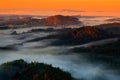 Cold misty foggy morning in a fall valley of Bohemian Switzerland park. Hills with fog, landscape of Czech Republic, National Park Royalty Free Stock Photo