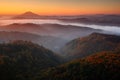 Cold misty foggy morning with sunrise in a fall valley of Bohemian Switzerland park. Hills with fog, landscape of Czech Republic, Royalty Free Stock Photo